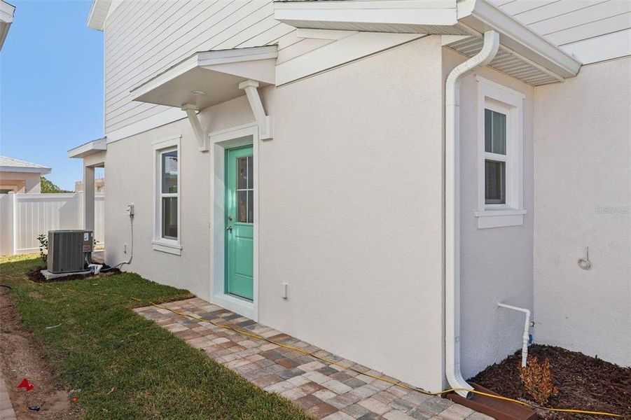 Exterior details and patio area of a home in Cyrene at Harmony, St. Cloud (Image 3).
