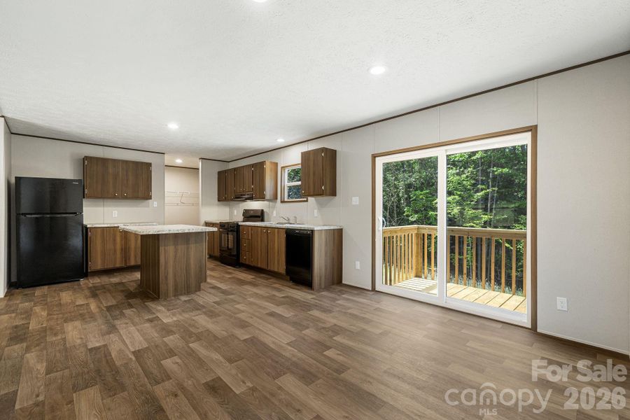 Sliding doors open to private back yard (over an acre!)