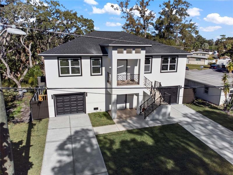 Front exterior of a new home in , New Port Richey, FL, highlighting curb appeal (Image 23).