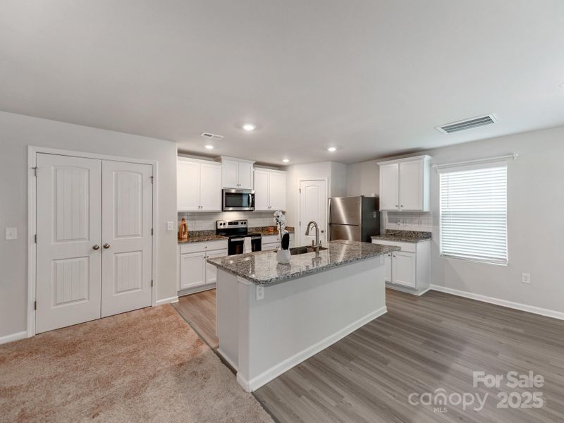Furnished interior view inside a new home in McKee Creek Village, Charlotte (Image 4). Furnished interior view inside a new home in McKee Creek Village, Charlotte (Image 4).