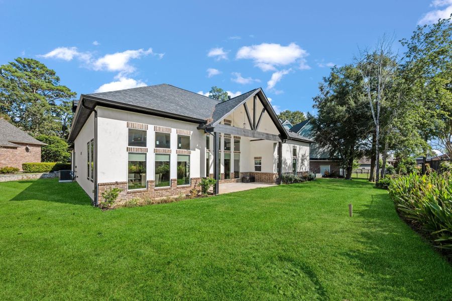 Low maintenance green space behind and on the side of the home.