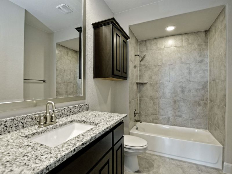 Representative furnished interior of a home built from the Madera II by Giddens Homes in Scofield Farms Estates, Georgetown (Image 239).