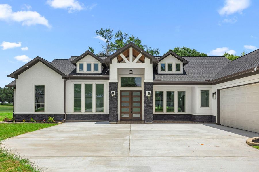 Front exterior of a new home in , Hempstead, TX, highlighting curb appeal (Image 24). Front exterior of a new home in , Hempstead, TX, highlighting curb appeal (Image 24).