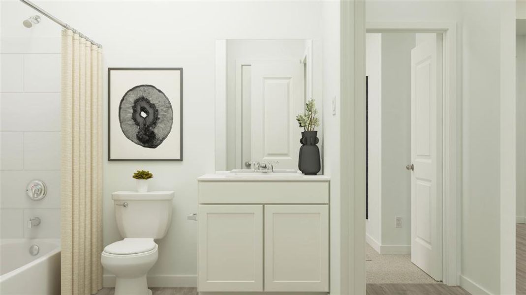 Full bathroom featuring vanity, toilet, wood-type flooring, and shower / tub combo with curtain