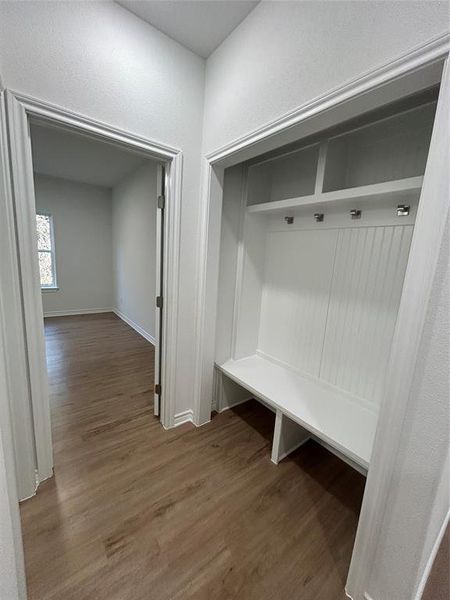 Mudroom with hardwood / wood-style flooring