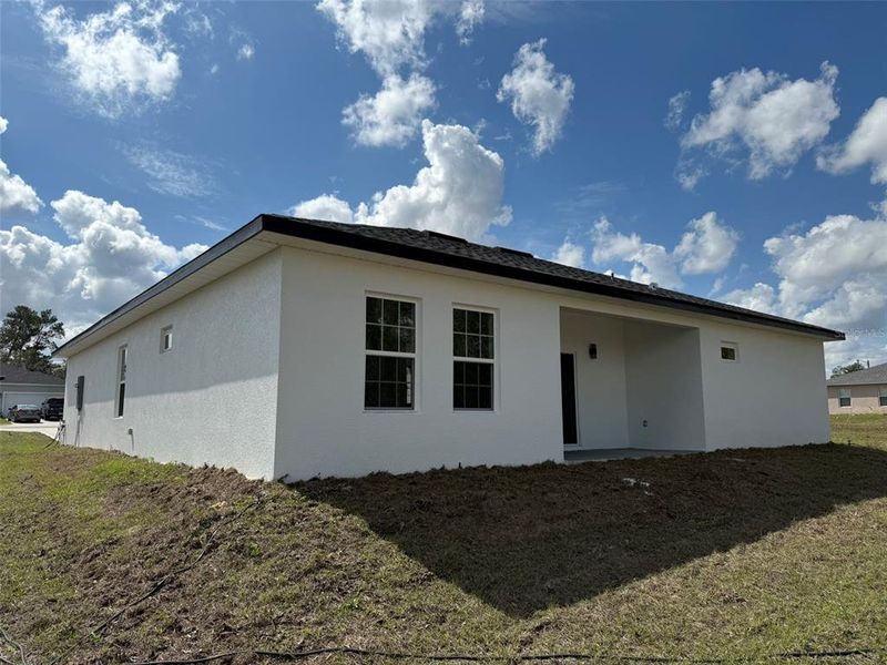 Front exterior of a new home in , Ocala, FL, highlighting curb appeal (Image 18).