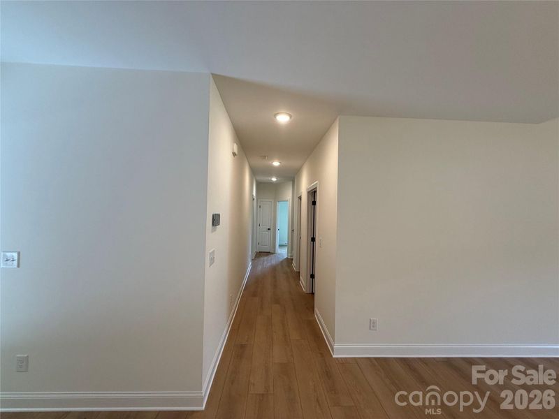 The same luxury vinyl plank flooring continues throughout the main level.