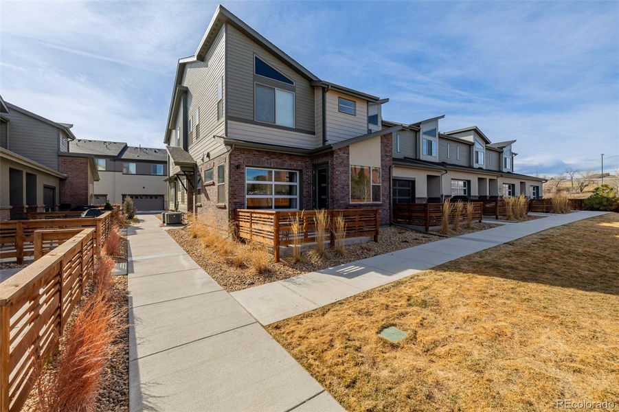 Front exterior of a new home in , Lakewood, CO, highlighting curb appeal (Image 1). Front exterior of a new home in , Lakewood, CO, highlighting curb appeal (Image 1).