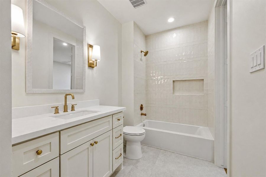 Guest Bathroom #2, with oversized marble vanity and linen closet