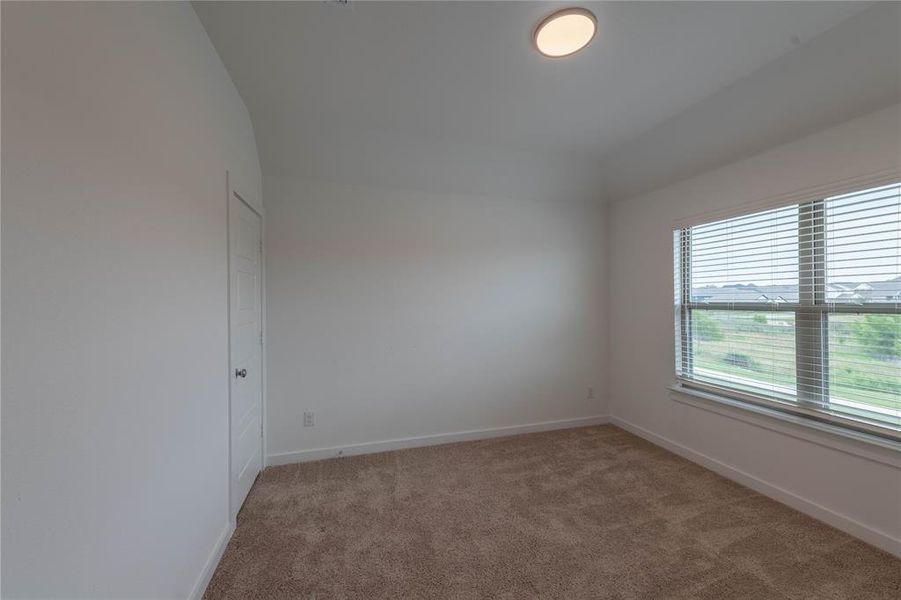 Spare room with carpet flooring and baseboards