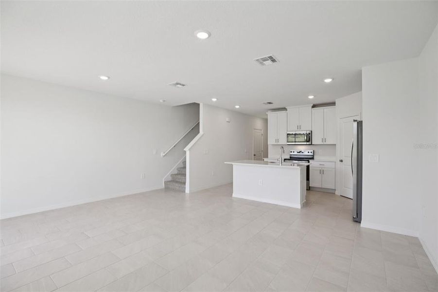 Spacious, unfurnished interior of a new home in The Reserve at Hammock Oaks Townes, Lady Lake (Image 37).