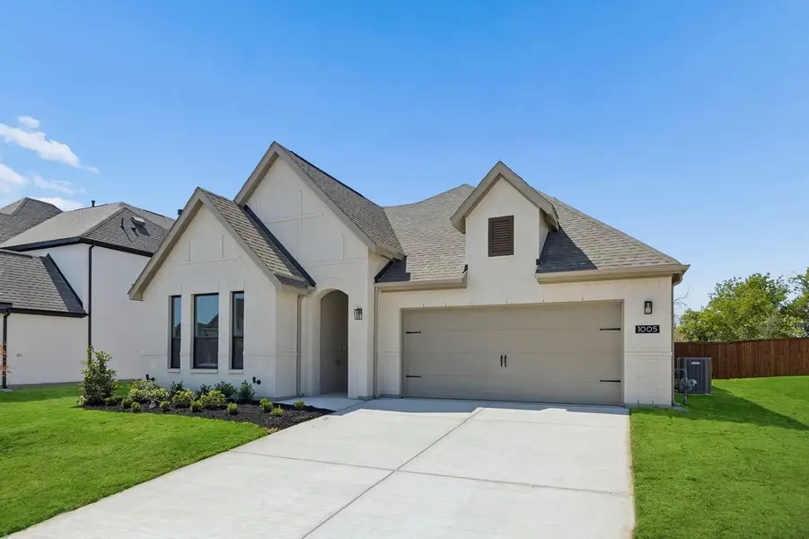 Front exterior of a new home in Parkmont – Timberbrook, Justin, TX, highlighting curb appeal (Image 2). Front exterior of a new home in Parkmont – Timberbrook, Justin, TX, highlighting curb appeal (Image 2).