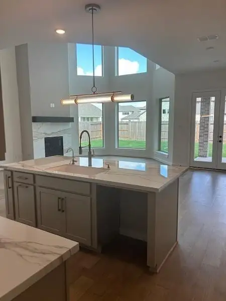 View of the family room with bay windows looking into the back yard.