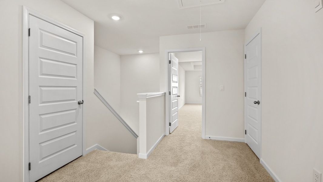 Representative unfurnished interior of a home built from the Salisbury by D.R. Horton in Inverness at Sugarloaf, Lawrenceville (Image 22).