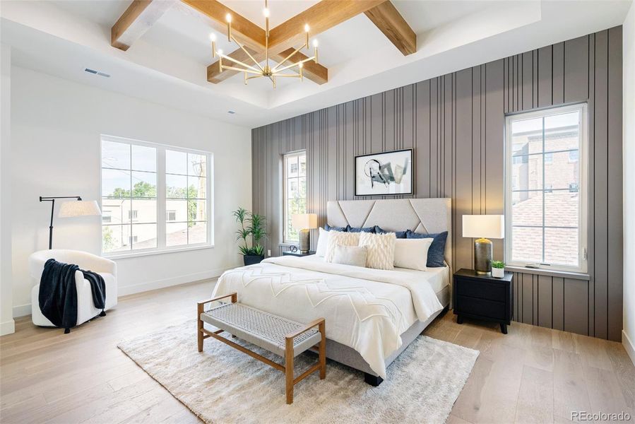 Ceiling accents add natural elements to primary suite