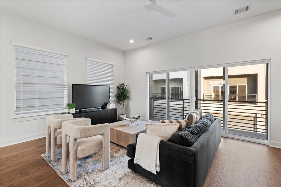 The arrangement showcases the scale of the room and offers multiple furniture layout options.