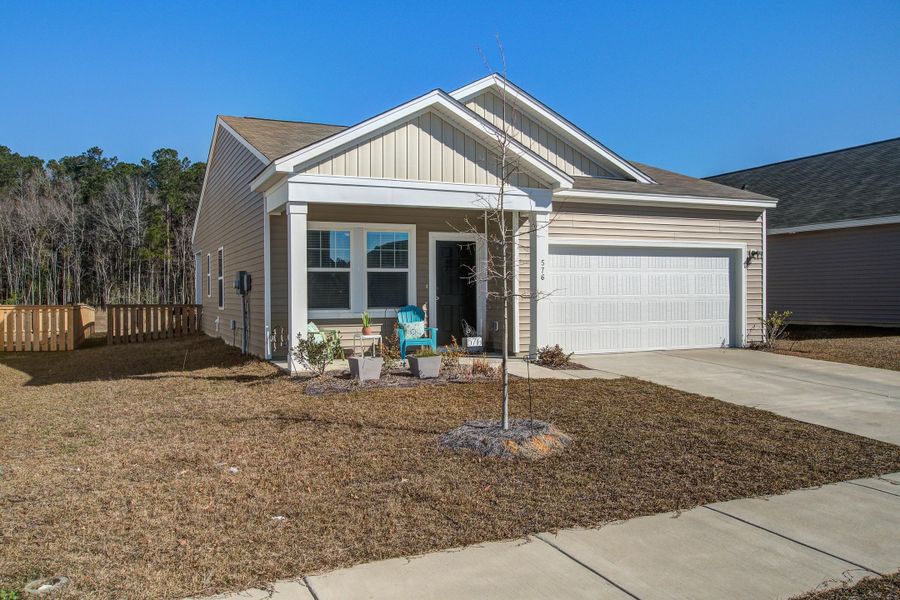Front exterior of a new home in Pender Woods at Cane Bay, Summerville, SC, highlighting curb appeal (Image 25).