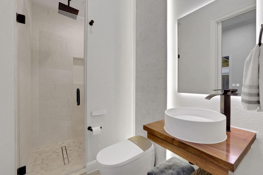 Full bathroom in the guest house. All toilets in the home have smart bidets w heated seats, diff temp water and dryer