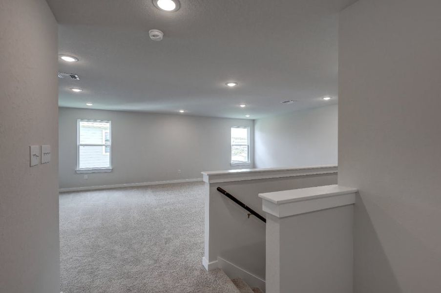 A room with a counter and a window.