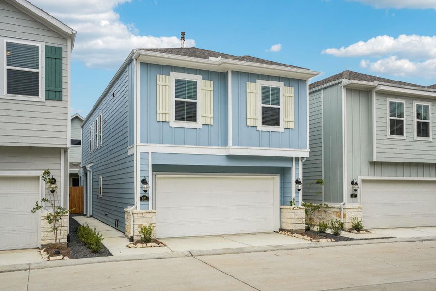 Front exterior of a new home in Kemah Crossing - City Series, Kemah, TX, highlighting curb appeal (Image 2). Front exterior of a new home in Kemah Crossing - City Series, Kemah, TX, highlighting curb appeal (Image 2).