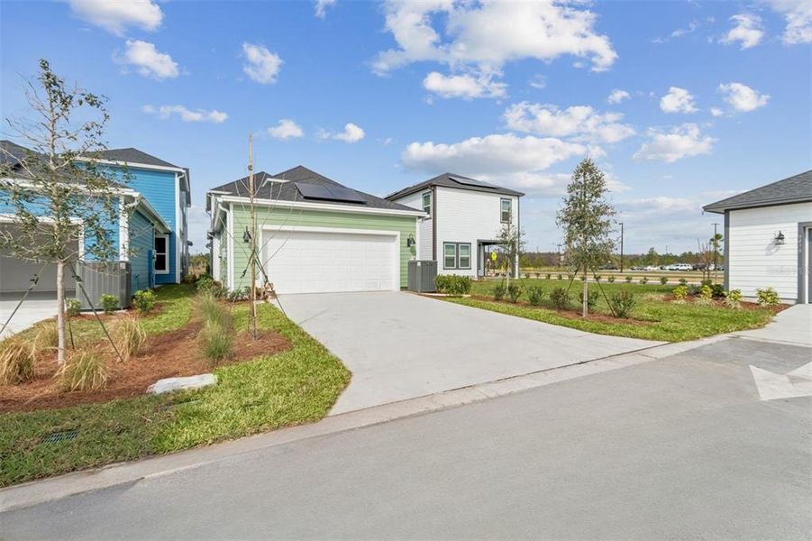 Front exterior of a new home in Laureate Park at Lake Nona - Garden Series, Orlando, FL, highlighting curb appeal (Image 25).