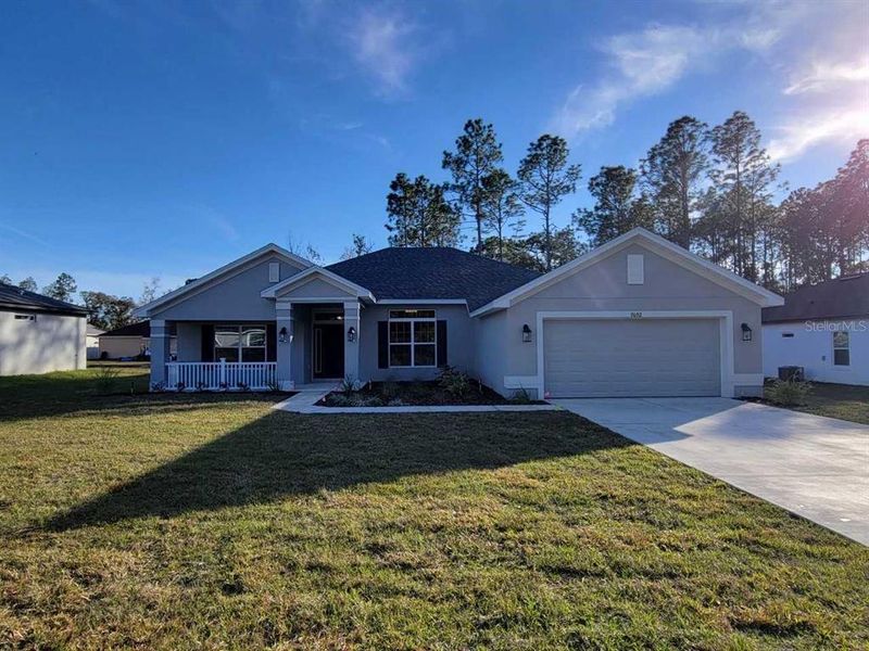 Front exterior of a new home in Marion Oaks, Ocala, FL, highlighting curb appeal (Image 2).