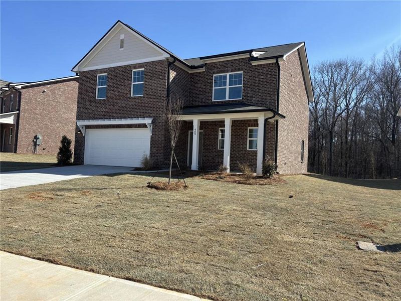 Front exterior of a new home in Kendall Grove, McDonough, GA, highlighting curb appeal (Image 7).
