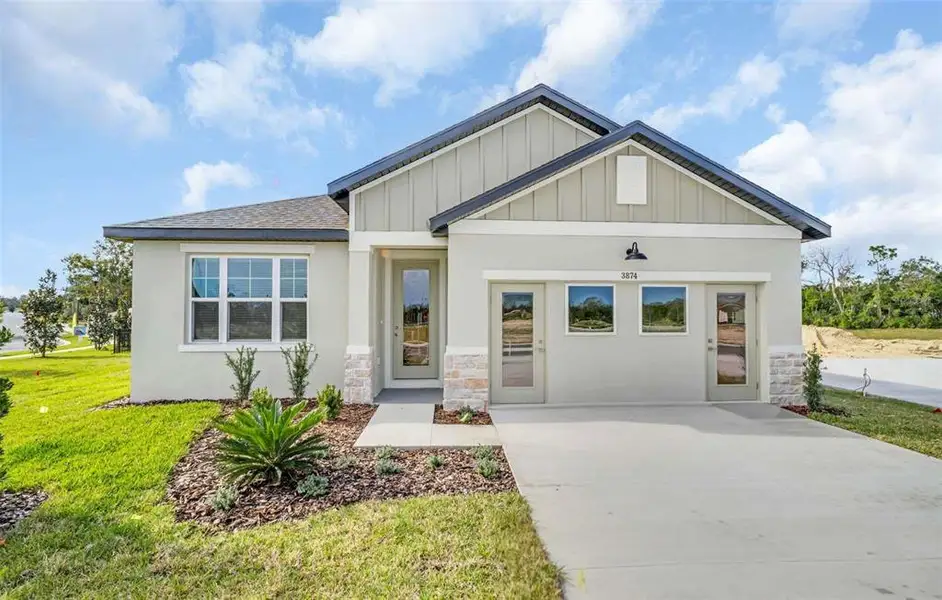 Front exterior of a new home in Arbor Meadows, Spring Hill, FL, highlighting curb appeal (Image 1). Front exterior of a new home in Arbor Meadows, Spring Hill, FL, highlighting curb appeal (Image 1).