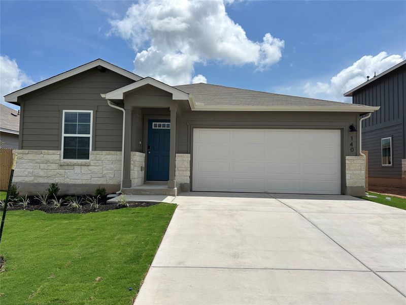 Front exterior of a new home in Eastern Wells, Jarrell, TX, highlighting curb appeal (Image 2). Front exterior of a new home in Eastern Wells, Jarrell, TX, highlighting curb appeal (Image 2).