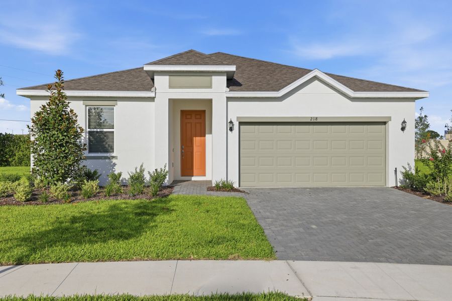 Front exterior of a new home in Tarpon Bay, Haines City, FL, highlighting curb appeal (Image 1). Front exterior of a new home in Tarpon Bay, Haines City, FL, highlighting curb appeal (Image 1).
