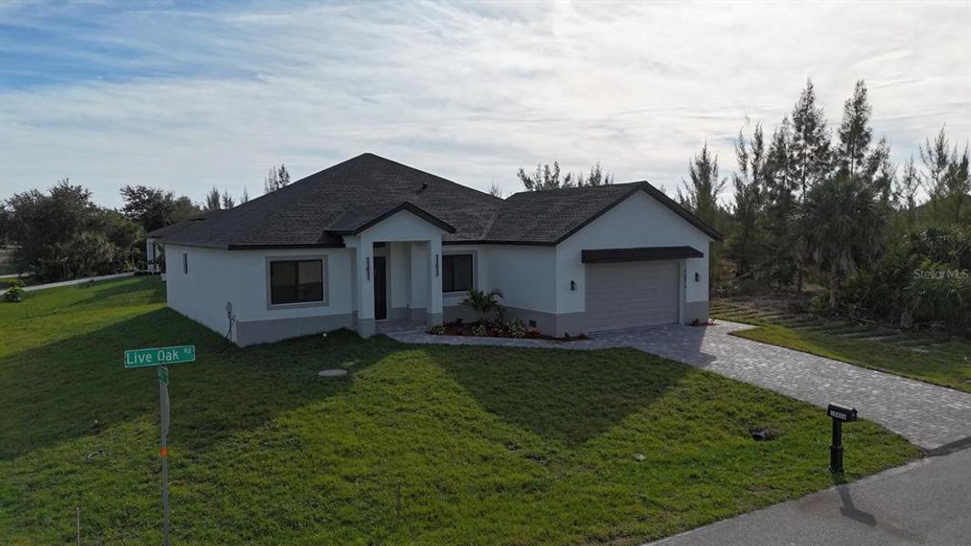 Front exterior of a new home in , Port Charlotte, FL, highlighting curb appeal (Image 33). Front exterior of a new home in , Port Charlotte, FL, highlighting curb appeal (Image 33).