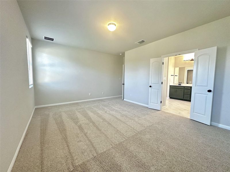 Spacious, unfurnished interior of a new home in The Colony 50s, Bastrop (Image 16).