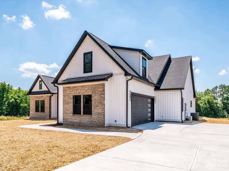 Front exterior of a new home in , Bessemer City, NC, highlighting curb appeal (Image 1). Front exterior of a new home in , Bessemer City, NC, highlighting curb appeal (Image 1).