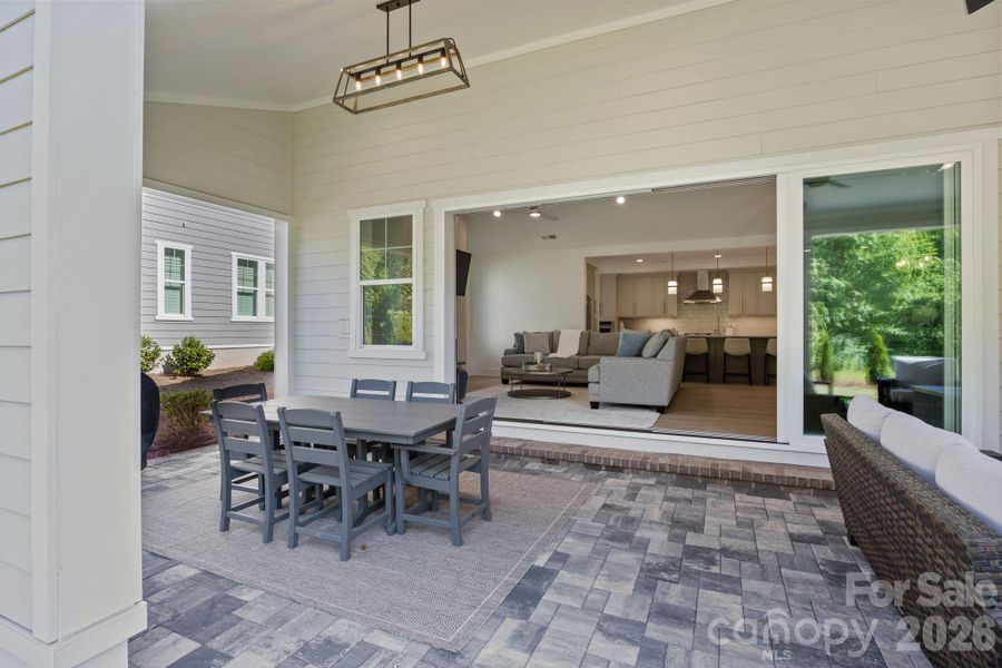 Al fresco dining area with chandelier ready for you to enjoy meals outdoors