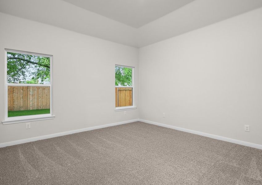 The master bedroom has two large windows. The master bedroom has two large windows.