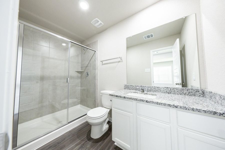 Furnished interior view inside a new home in Mackenzie Creek, Conroe (Image 16).
