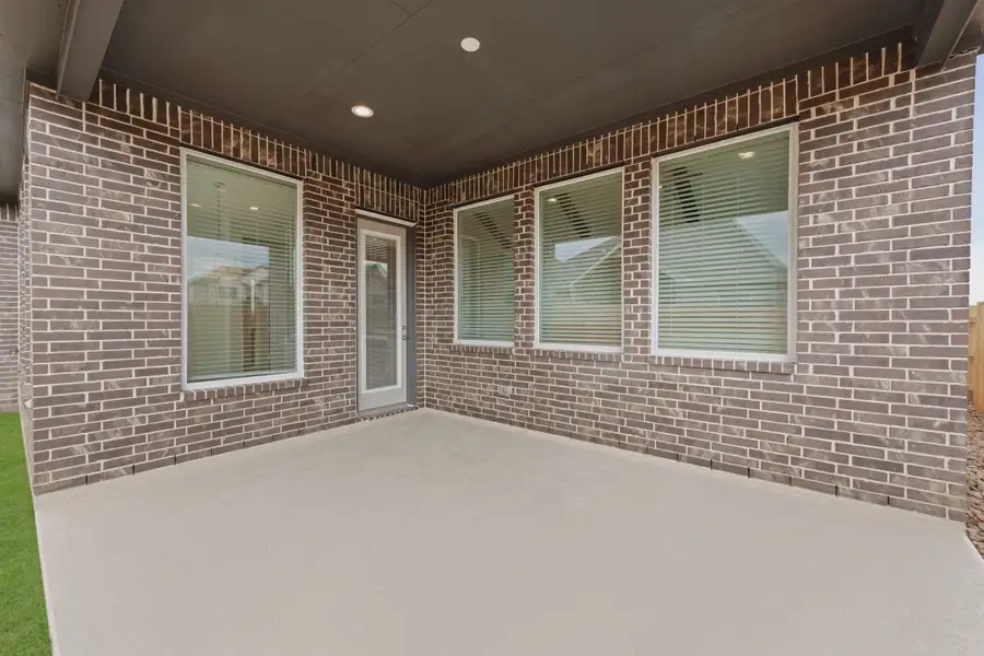 Representative exterior details of a home built from the Malibu by Chesmar Homes in Meridiana 50's and 60's, Manvel (Image 4).