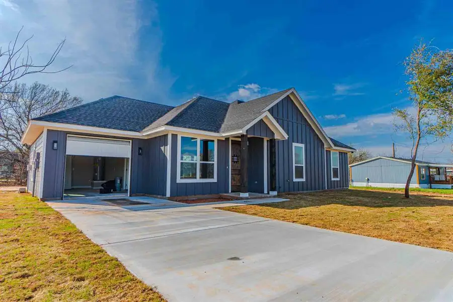 Front exterior of a new home in , Granbury, TX, highlighting curb appeal (Image 23). Front exterior of a new home in , Granbury, TX, highlighting curb appeal (Image 23).