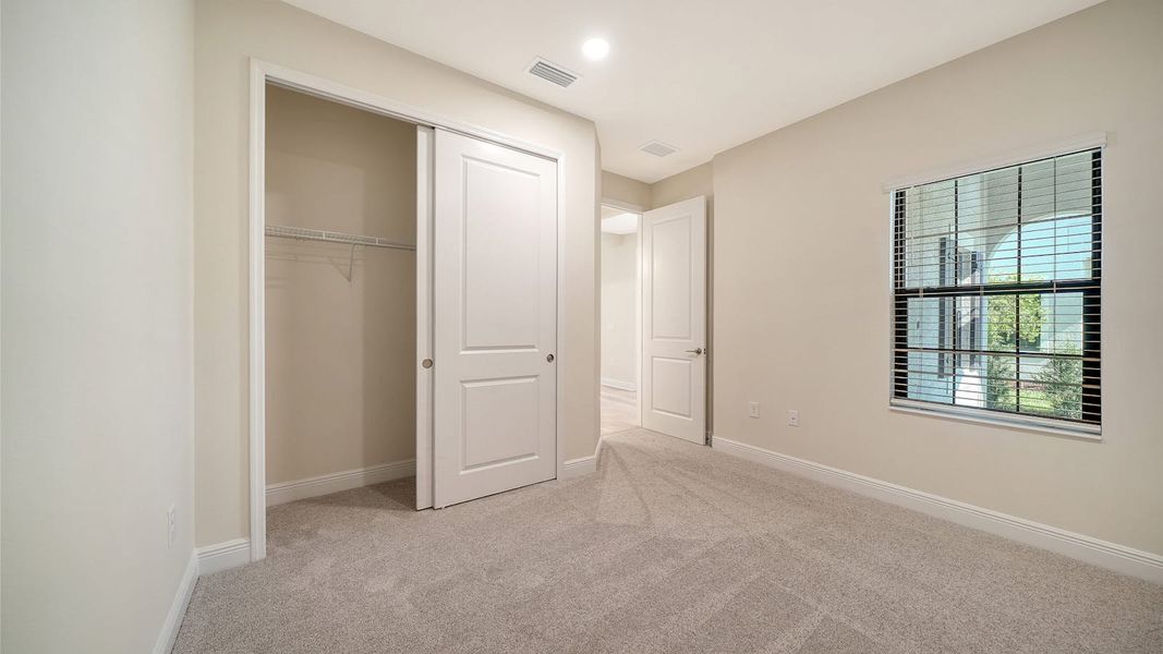 Spacious, unfurnished interior of a new home in Vistera of Venice Real Estate and Homes for Sale in Venice, FL - Neal Communities, Nokomis (Image 26).