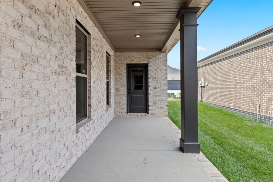 Exterior details and patio area of a home in The Paddock Courtyard, Bungalow, & Villa Homes, Gallatin (Image 3).
