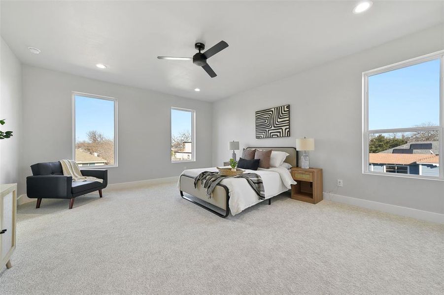 Bedroom featuring ceiling fan and light carpet