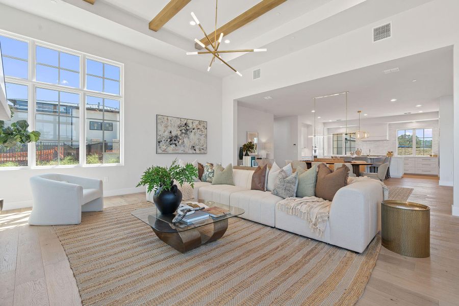 Living area with recessed lighting, a chandelier, light wood-style flooring, and visible vents Living area with recessed lighting, a chandelier, light wood-style flooring, and visible vents