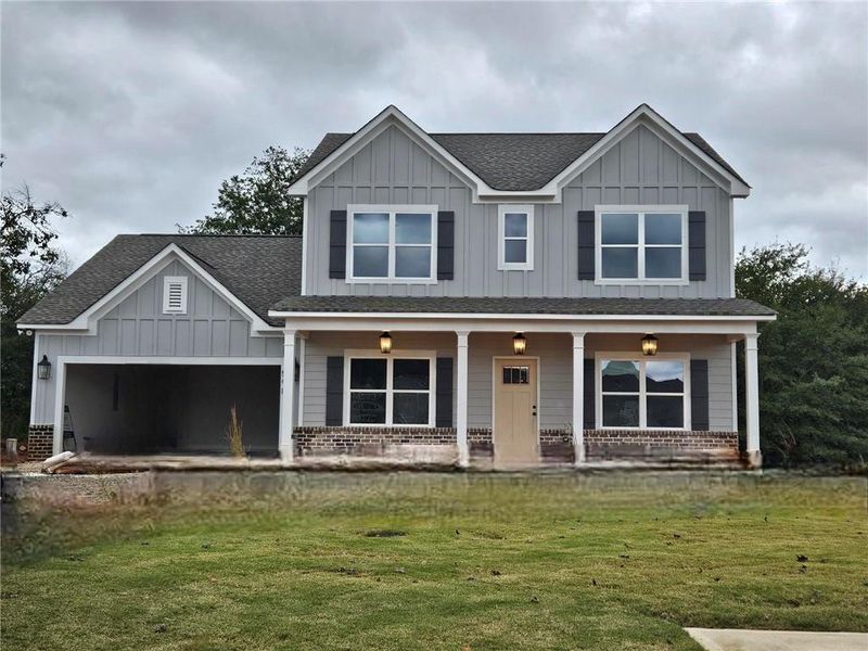 Front exterior of a new home in Calgary Downs, Winder, GA, highlighting curb appeal (Image 2).