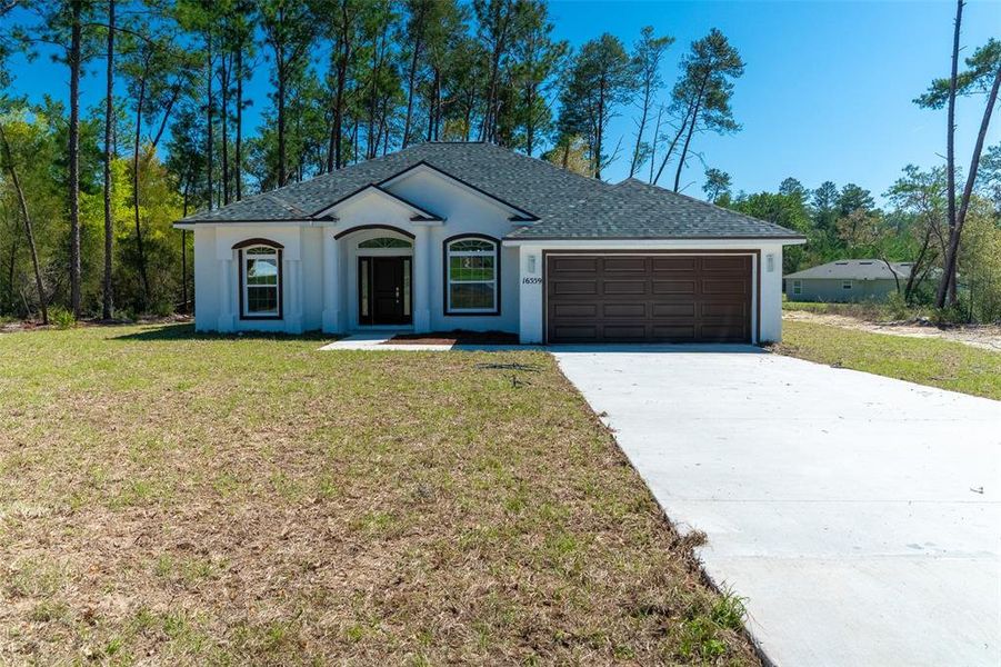 Front exterior of a new home in , Ocala, FL, highlighting curb appeal (Image 21).
