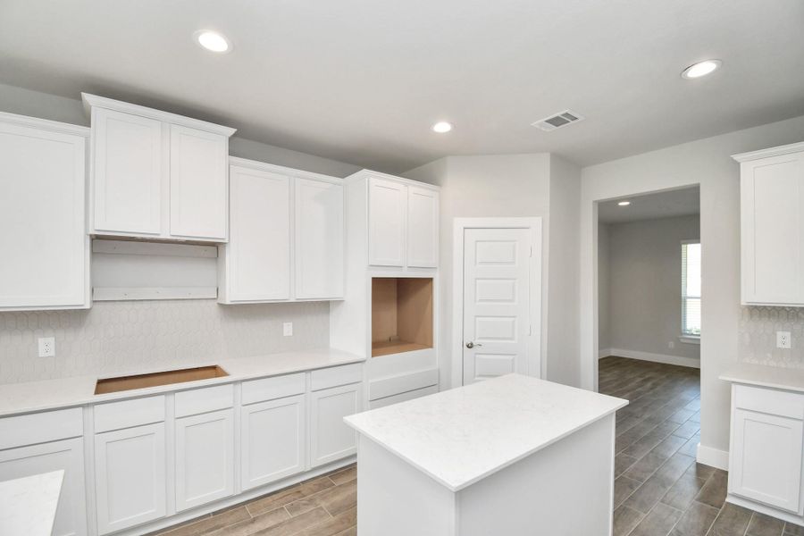 The extended counter area adds both practicality and style, making meal preparation a breeze. Every detail is thoughtfully designed to enhance the kitchen's functionality and aesthetic appeal. The extended counter area adds both practicality and style, making meal preparation a breeze. Every detail is thoughtfully designed to enhance the kitchen's functionality and aesthetic appeal.