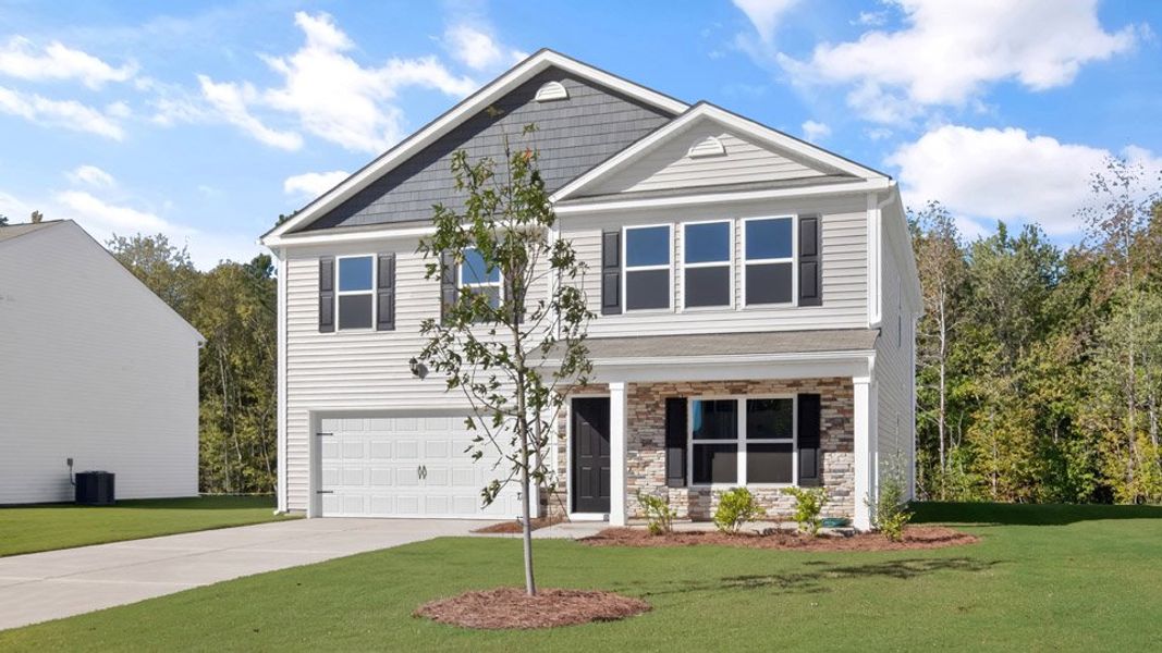 Front exterior of a new home in Olive Branch, Clayton, NC, highlighting curb appeal (Image 2). Front exterior of a new home in Olive Branch, Clayton, NC, highlighting curb appeal (Image 2).