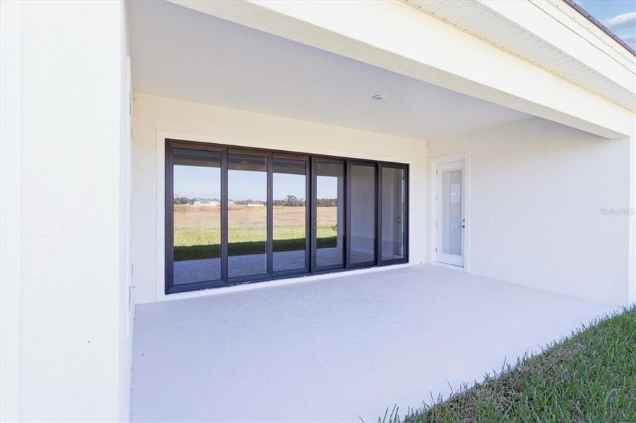 Exterior details and patio area of a home in Oakfield, Parrish (Image 3).