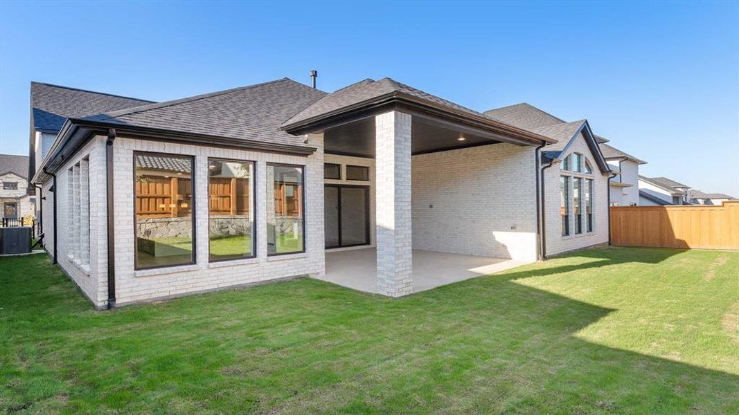 Exterior details and patio area of a home in Fields 60', Frisco (Image 4).