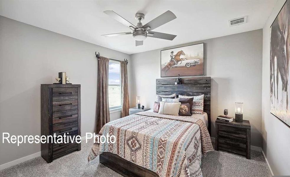 Carpeted bedroom with ceiling fan