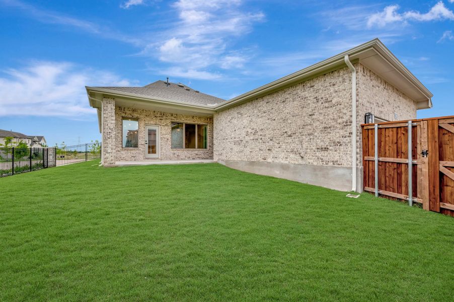 Exterior details and patio area of a home in Karis - Village Series, Crowley (Image 3).